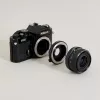 Urth objektív adapter Pentax K - Nikon F - optikai elemmel